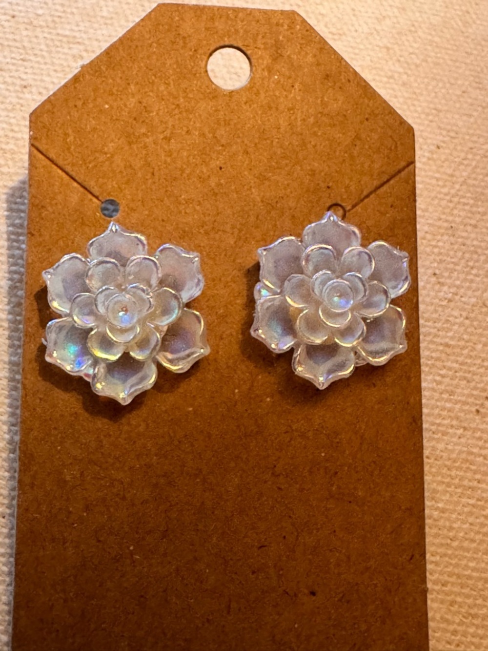 Handcrafted white, iridescent, carved flower-shaped stud earrings Resin